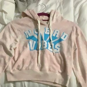 Size small women’s. Light pink white wash. Light blue words. Cropped hoodie.